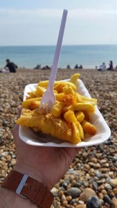 Me eating fish & chips on the beach of the south coast in the beach town of Brighton, England.