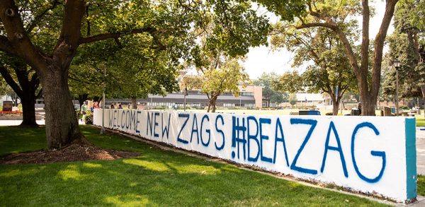 Wall by College Hall painted to say "Welcome New Zags! #Be a Zag