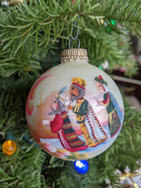 Colorful hand painted ornament depicting the three magi.